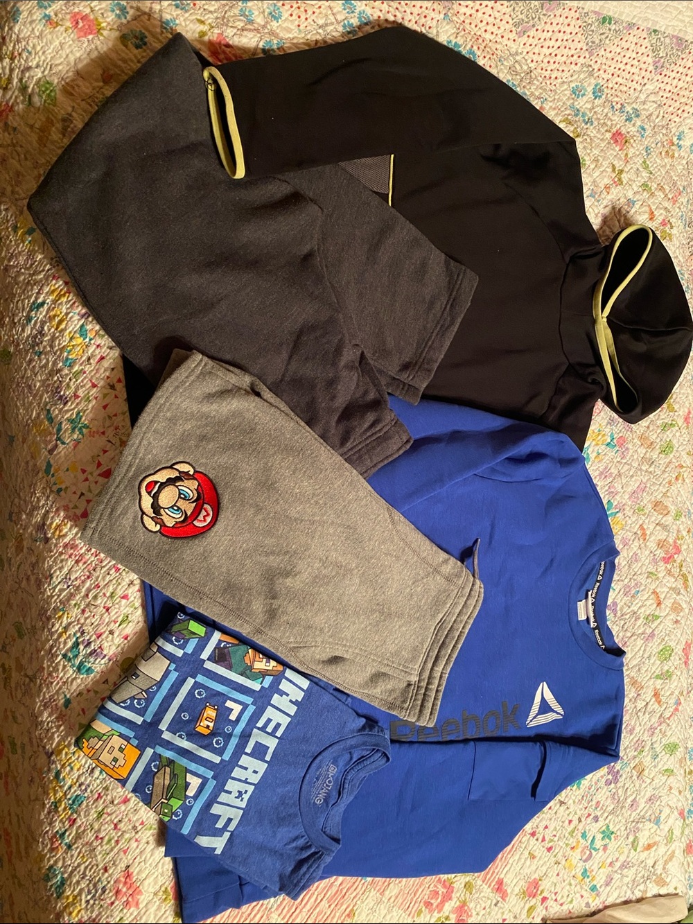 Boy’s lot shirts, shorts and sweat pants size large and 14-16